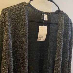 Shimmer shrug with tag